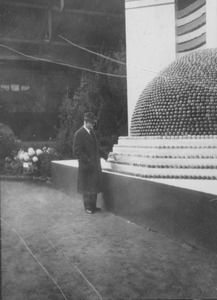 Ralph A. Van Meter standing before horticultural exhibit