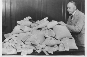 Philip H. Smith with bags of vegetable seeds
