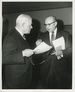 Hermann G. Place and Dr. DiMichael talking at Thanksgiving celebration