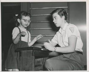 Physical therapist with a young girl