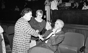 Mayor Kevin H. White with two women at the Strand Theatre