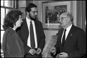 Russell A. Hulse (right) and wife (?), talking with unidentified man at a reception with Massachusetts state legislators honoring his Nobel Prize in Physics