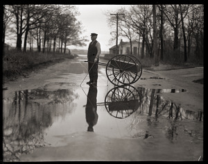 Otis Fish, the blind clam digger of Falmouth, with cane and cart