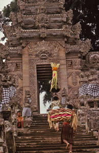 Boy watching arrival of offerings