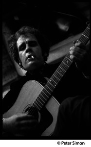 Tim Hardin playing guitar and smoking at the Unicorn Coffee House, Boston, Mass.