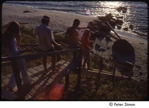 Ram Dass (right), Tukaram Das, Chaitanya Maha Prabu, and an unidentified woman descending stairs to the beach