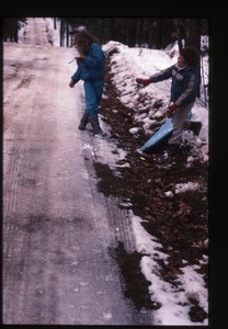 Two children by road in snow