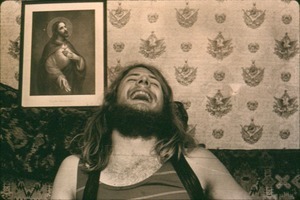 Michael Metelica laughing. This photograph was in the same set as that published in the Greenfield Recorder article where he first announced his past lives as Robert E. Lee and Peter the Apostle