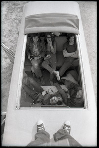 May Day concert and demonstrations: view through a sunroof of Albertson's friends huddled in a Volkswagen microbus