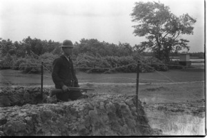 Militia standing guard in village; Long An.