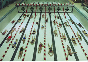 Students at the bottom of the empty pool in Linkletter Natatorium
