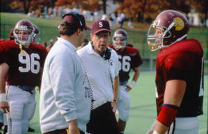 Football Players and Head SC Coach Mike Delong on the sidelines