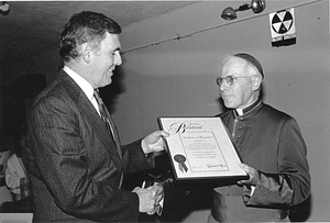 Mayor Raymond L. Flynn presenting award to Bishop Lawrence J. Riley