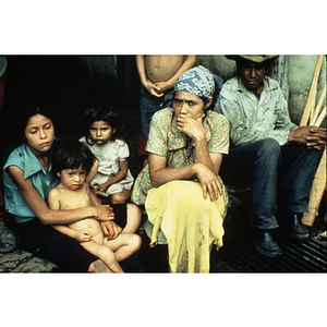 Woman sitting with children