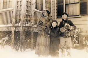 Marguerite Kiley, her cousins Patricia Kiley and her brother Edward in front of the family home in winter