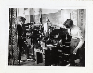 [Students working at machines]