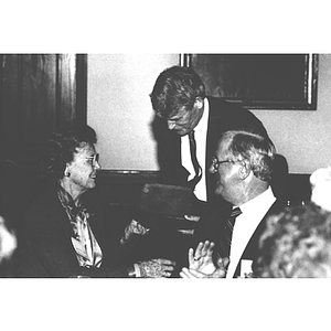 President Curry presents George and Lorraine Snell with a piece of the U.S.S. Constitution