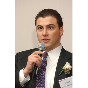 James Bonetti, new inductee, speaks into the microphone at The National Council Dinner