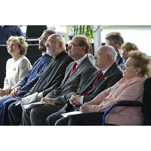 Guests sit listening to a speaker at the groundbreaking ceremony for the George J. Kostas Research Institute for Homeland Security