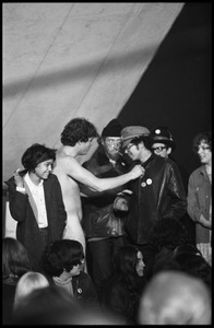 Naked man and Yippies on stage at the Counter-inaugural ball, 1969