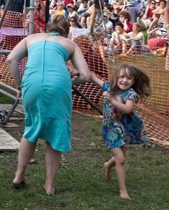 Woman and young girl dancing in the audience at the Clearwater Festival