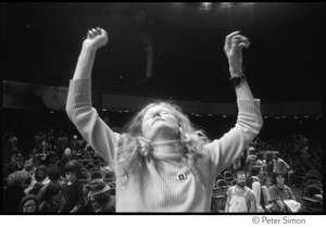 Audience member raising her arms is ecstasy at the Kohoutek Festival of Consciousness