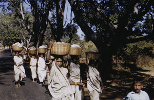 Tribal women carrying baskets of produce to market in Ranchi