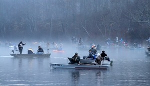 Opening day of trout season: Fishermen crowd Silver Spring Pond in various boats at dawn Saturday