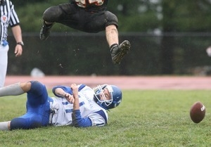 Cumberland High School football player jumps over opponent