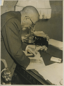 W. E. B. Du Bois working on his desk