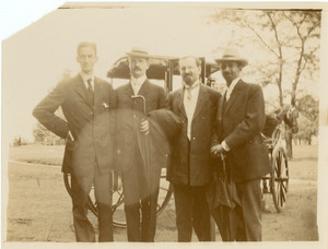 W. E. B. Du Bois and three unidentified men standing in front of buggy