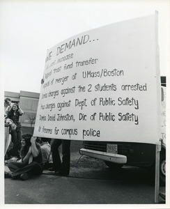 Board of Trustees fee increase demonstration: Charles Bagli holding sign