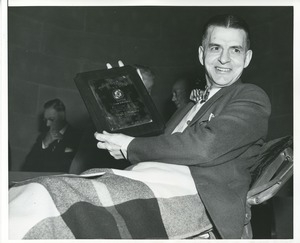 Harry E. Smithson holds his 1953 President's Trophy