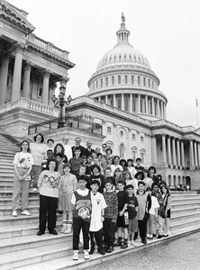 Visitors posed on the steps of the United States Capitol building