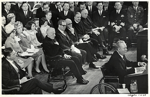 Mayor John F. Collins speaking at unidentified event with crowd behind him