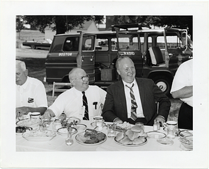 Unidentified men with Mayor John F. Collins at a luncheon