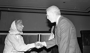 Mayor Kevin H. White greeting an unknown woman at the Strand Theatre