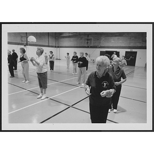 Older adults exercising in gym