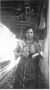 One female textile worker at a spinning frame. [02]