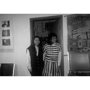 Two women standing in front of an open door in the Inquilinos Boricuas en Acción offices.