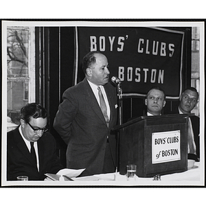 A man speaking at the podium during a Boys' Clubs of Boston awards event