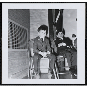 Two boys attend a Boys' Club of Boston St. Patrick's Day inaugural ball and exercises event