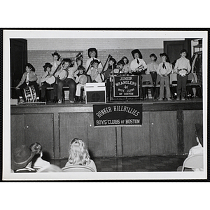 The Bunker Hillbillies play their instruments on stage