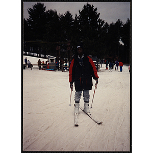 A teenage boy in skis holds poles at Nashoba Valley