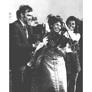 1969 Homecoming Queen being crowned by last year's queen and handed roses