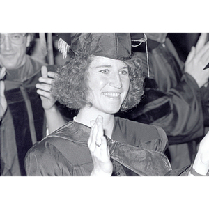 Graduate smiling at the School of Law commencement ceremony for the Class of 1987