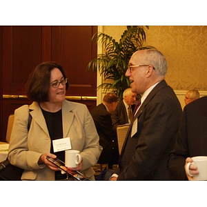 Ann McCartan and Paul Garber talking at the College of Business Administration's CEO Breakfast