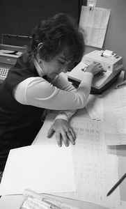 Rodney Hunt office worker using an adding machine