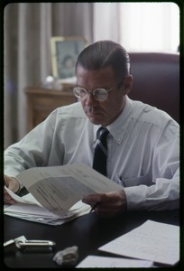 Defense Secretary Robert S. McNamara, working at his desk