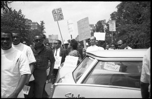 Protesters at a civil rights and fair housing demonstration: 'Abolish ghettos'